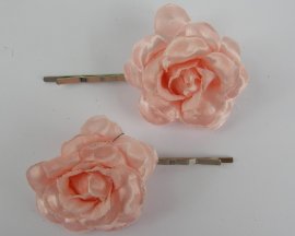 2 Schuifspelden met roos roze.