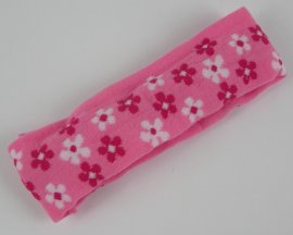 Haarband met bloem donker roze.