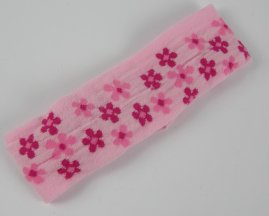 Haarband met bloem licht roze.