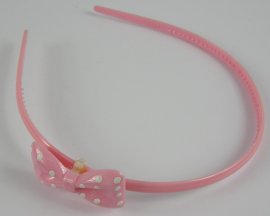 Diadeem licht roze met strik.