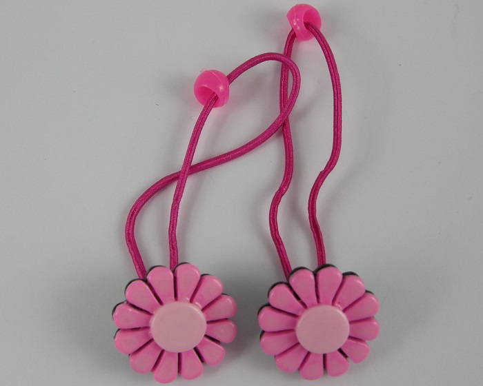 (image for) 2 haarelastieken met bloem roze.